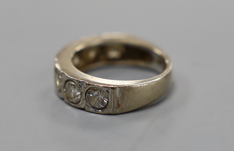 A modern 18ct white gold and seven stone diamond set half hoop ring, size J/K, gross weight 5.8 grams